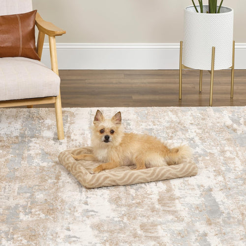 Wave Tan bolster dog bed inside a crate